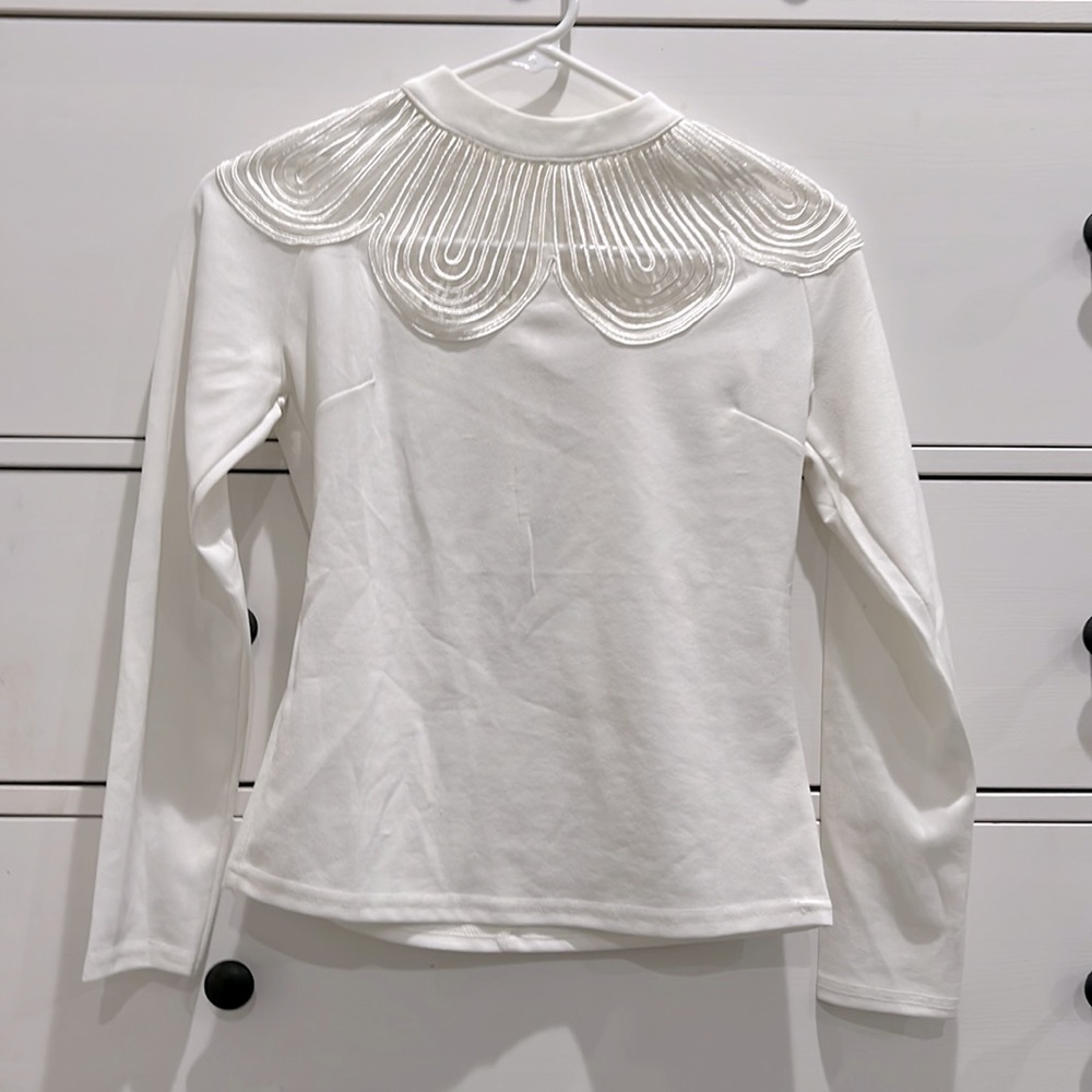 Small white long sleeve shirt